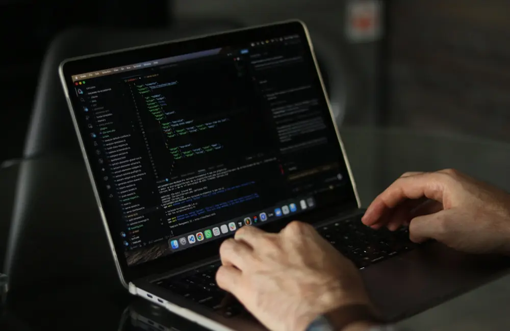 Developer building custom business software in a Dubai office